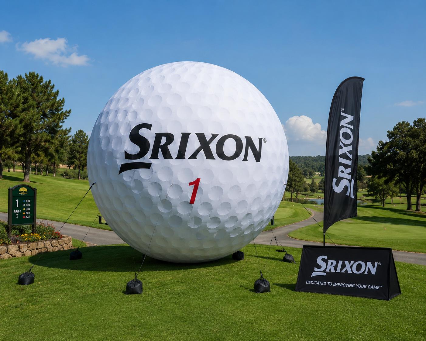 Giant inflatable Srixon golf ball on a golf course tee box